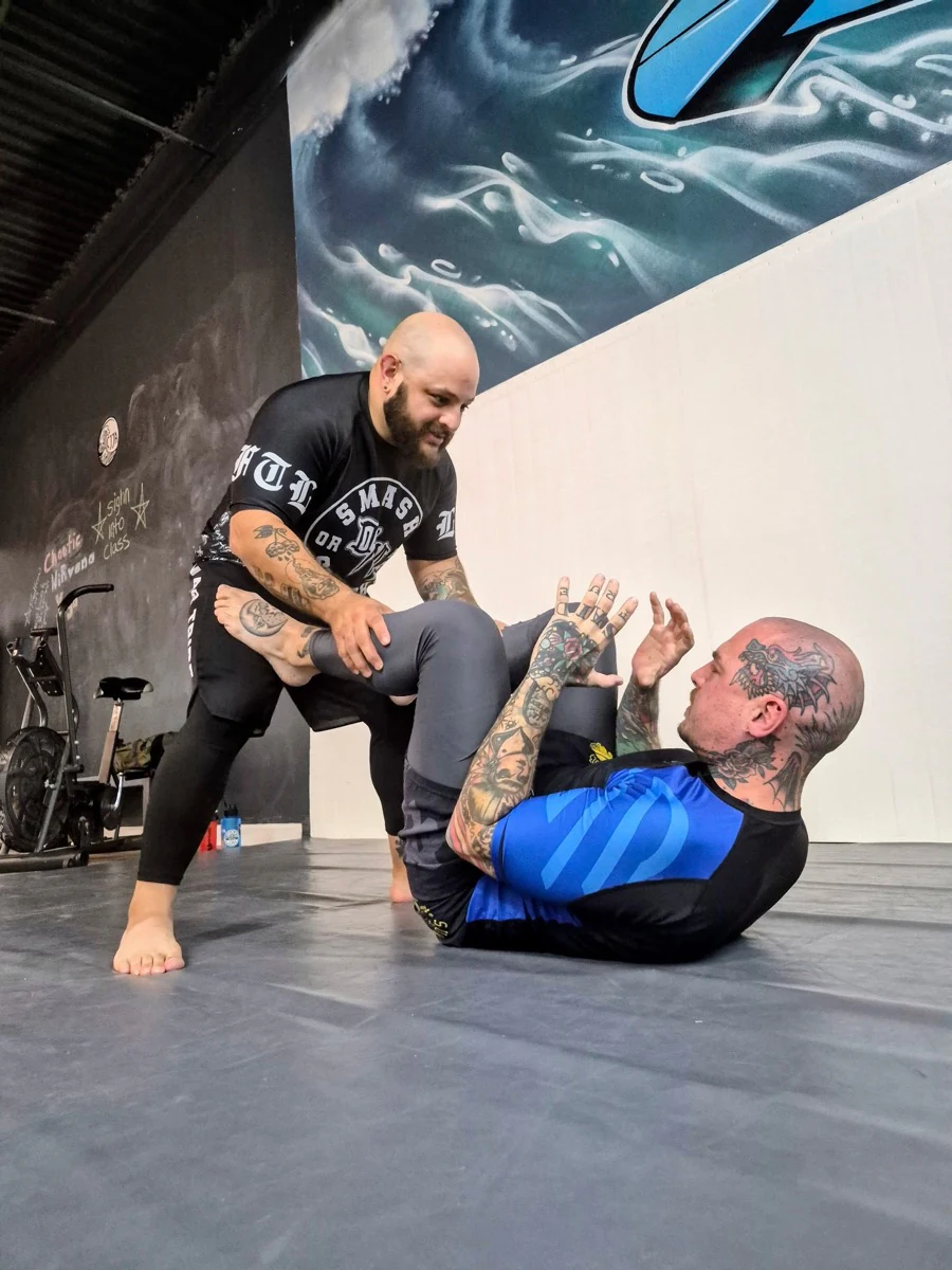 Two no-gi training partners practicing an open guard position