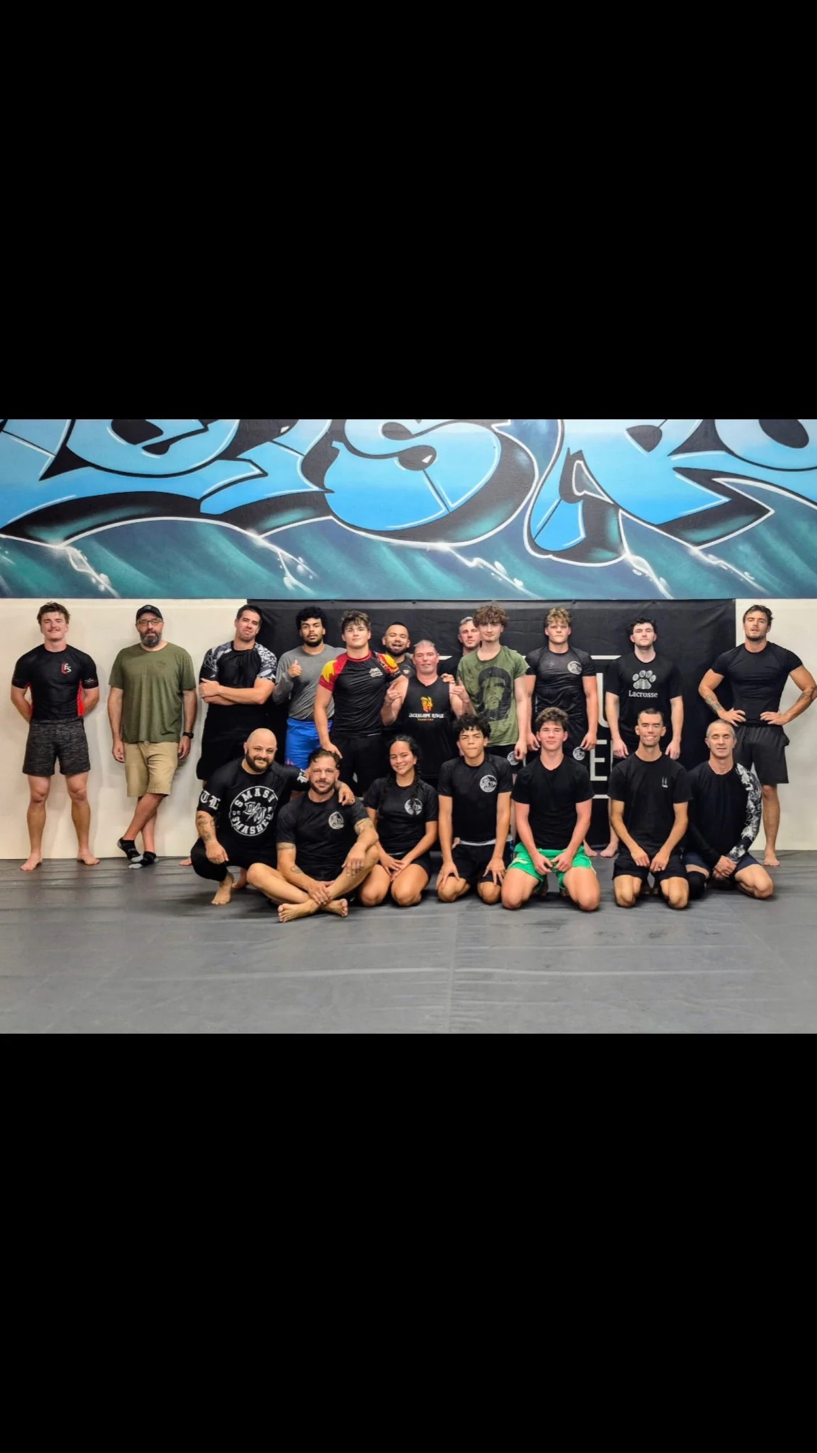 CJJA training partners gathered for a team photo on the mats